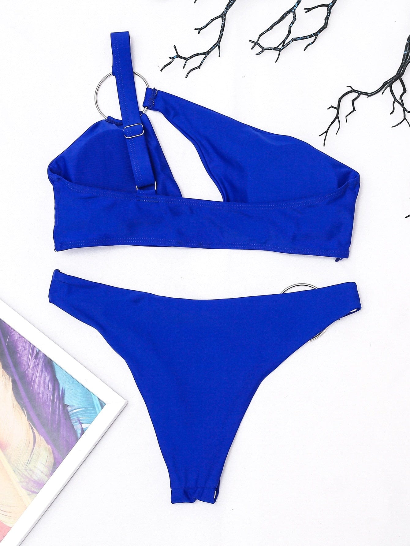 Asymmetrical swimsuit with adjustable bra.