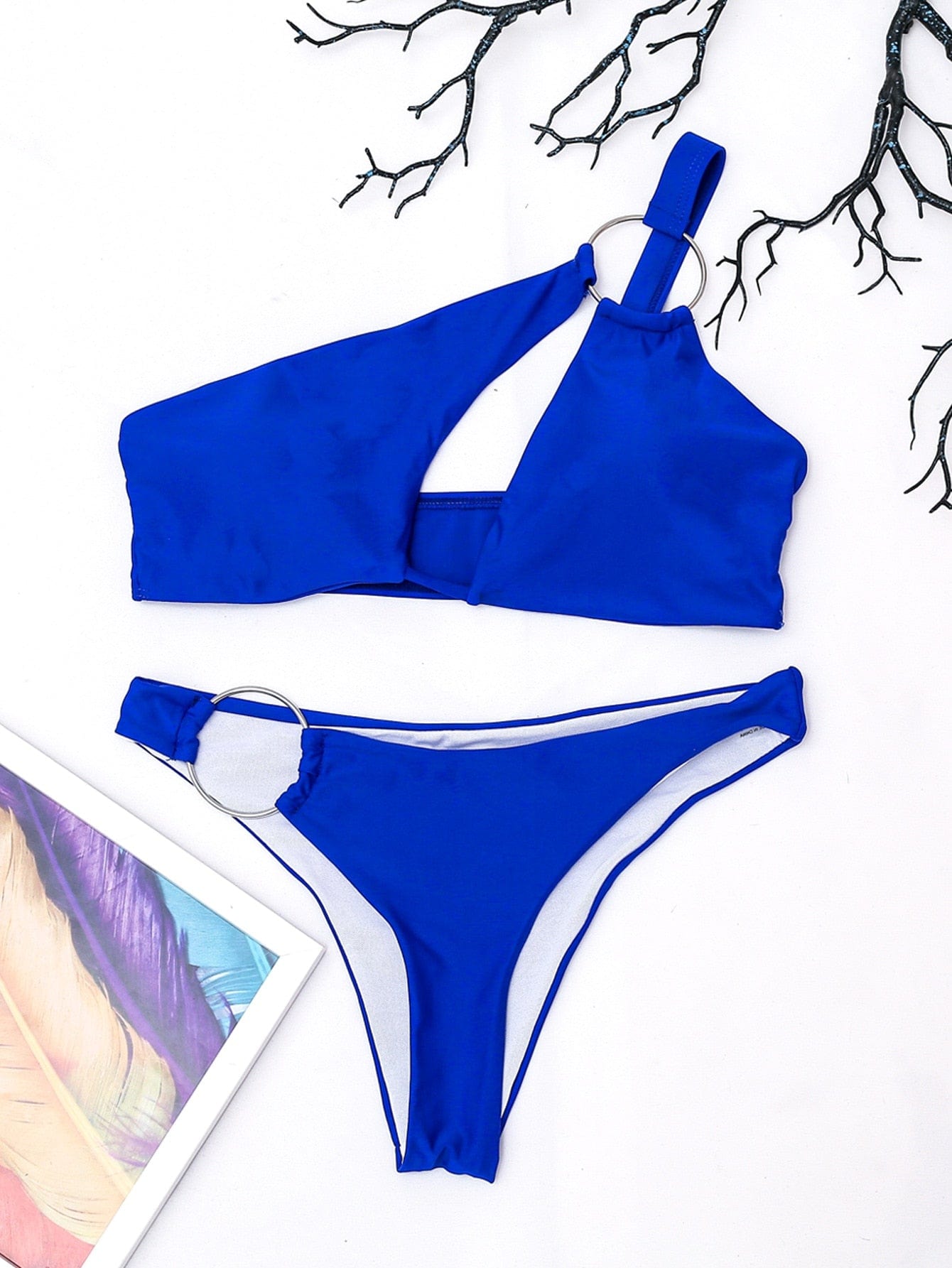 Asymmetrical swimsuit with adjustable bra.