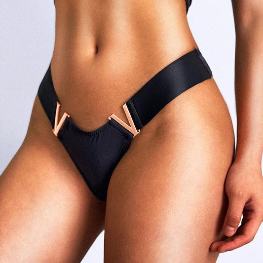 Fig leaves with metal elements in rose gold colour.