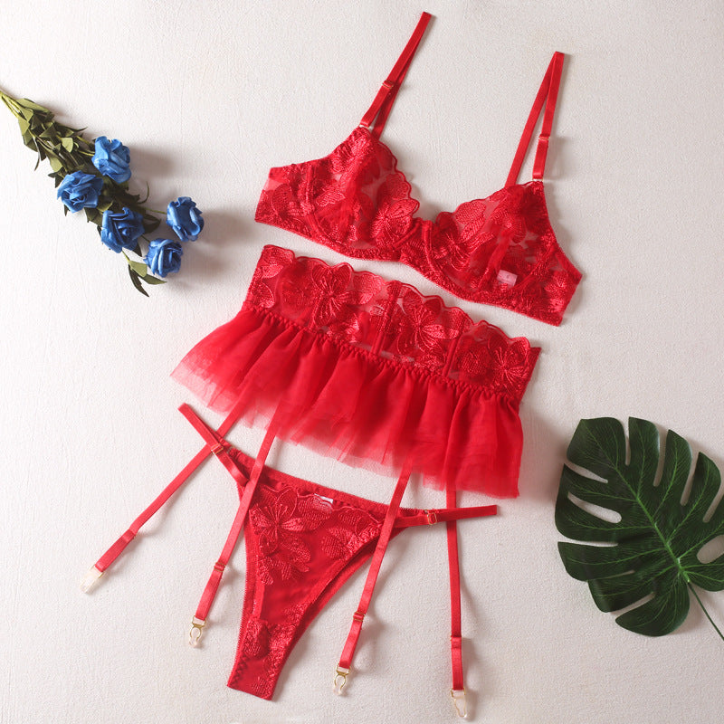 A set of lingerie made from sheer material with a floral pattern.
