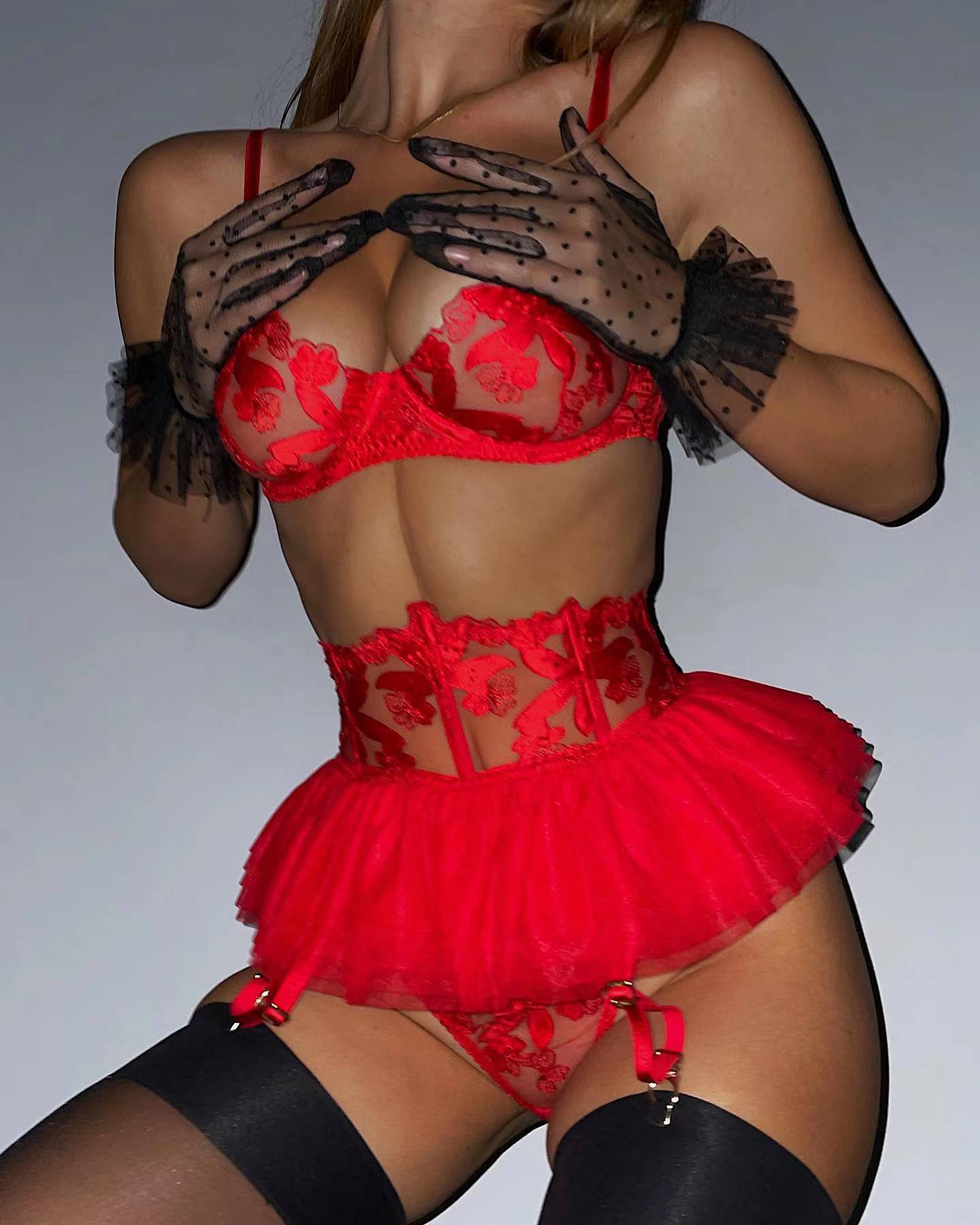 A set of lingerie made from sheer material with a floral pattern.