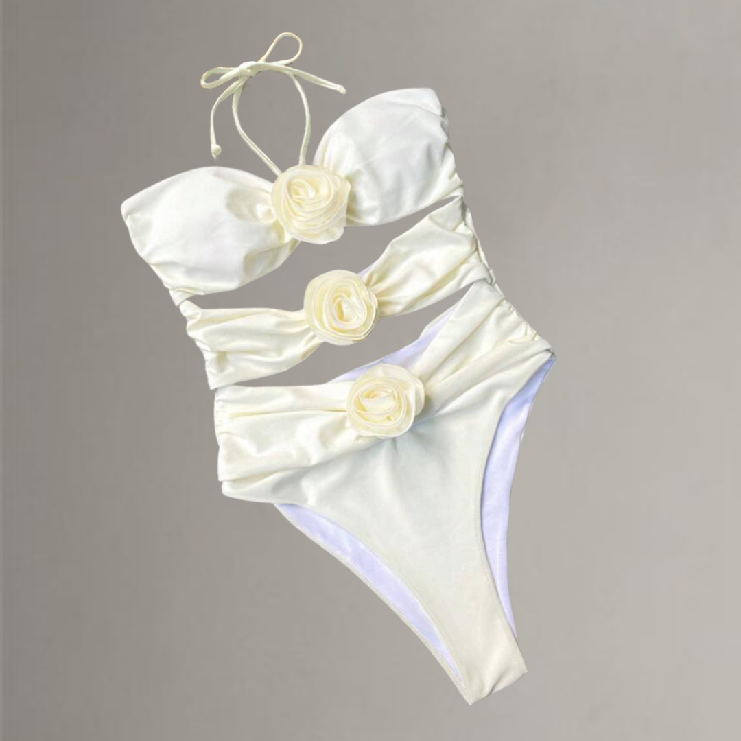 One-piece swimsuit with decorative cut-outs at the waist.