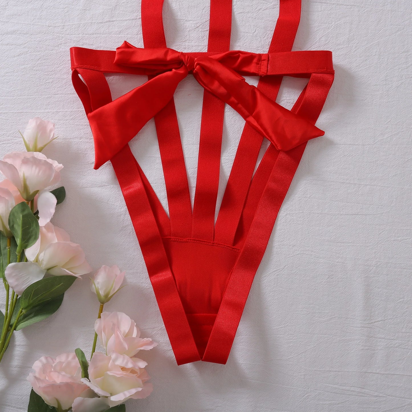 Body with a deep neckline and a bow on the bust.