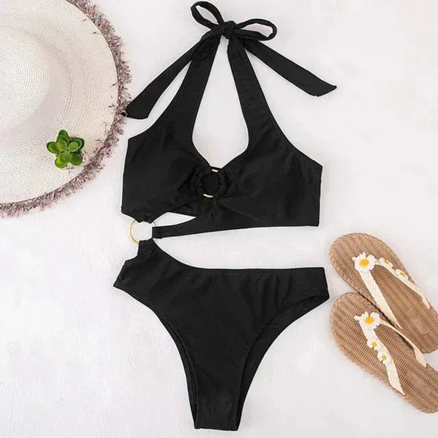 One-piece swimsuit with decorative rings