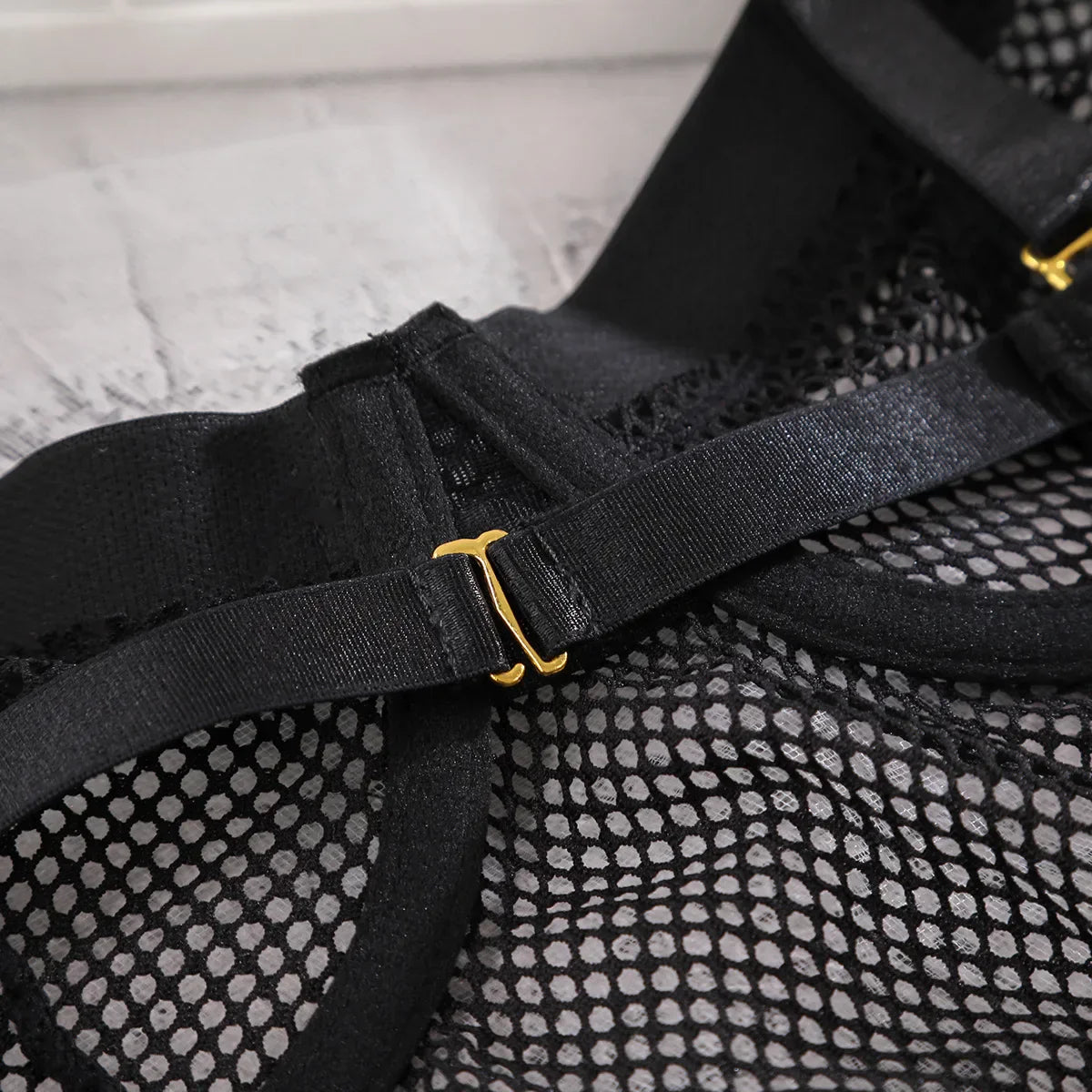 Mesh bodysuit with choker.