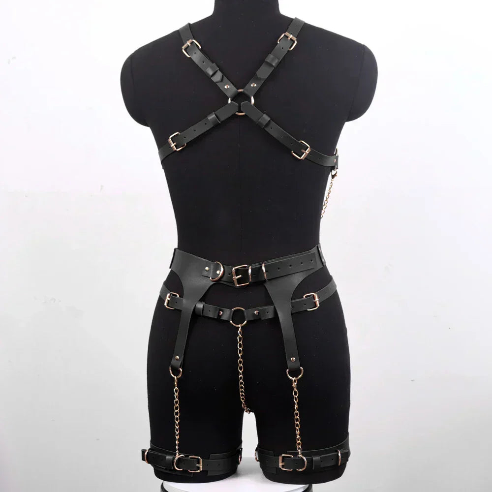 A complete leather lingerie set with metal chains.