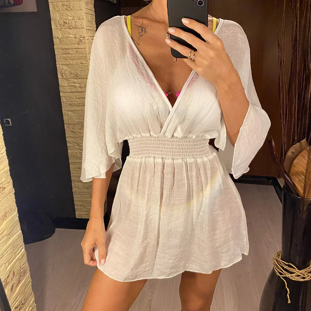 Breezy beach dress with a deep wrap neckline.