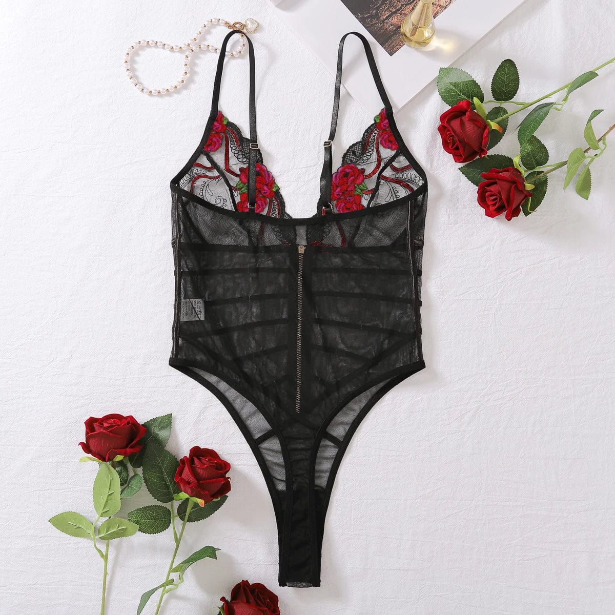 Sheer bodysuit with embroidery on the bust