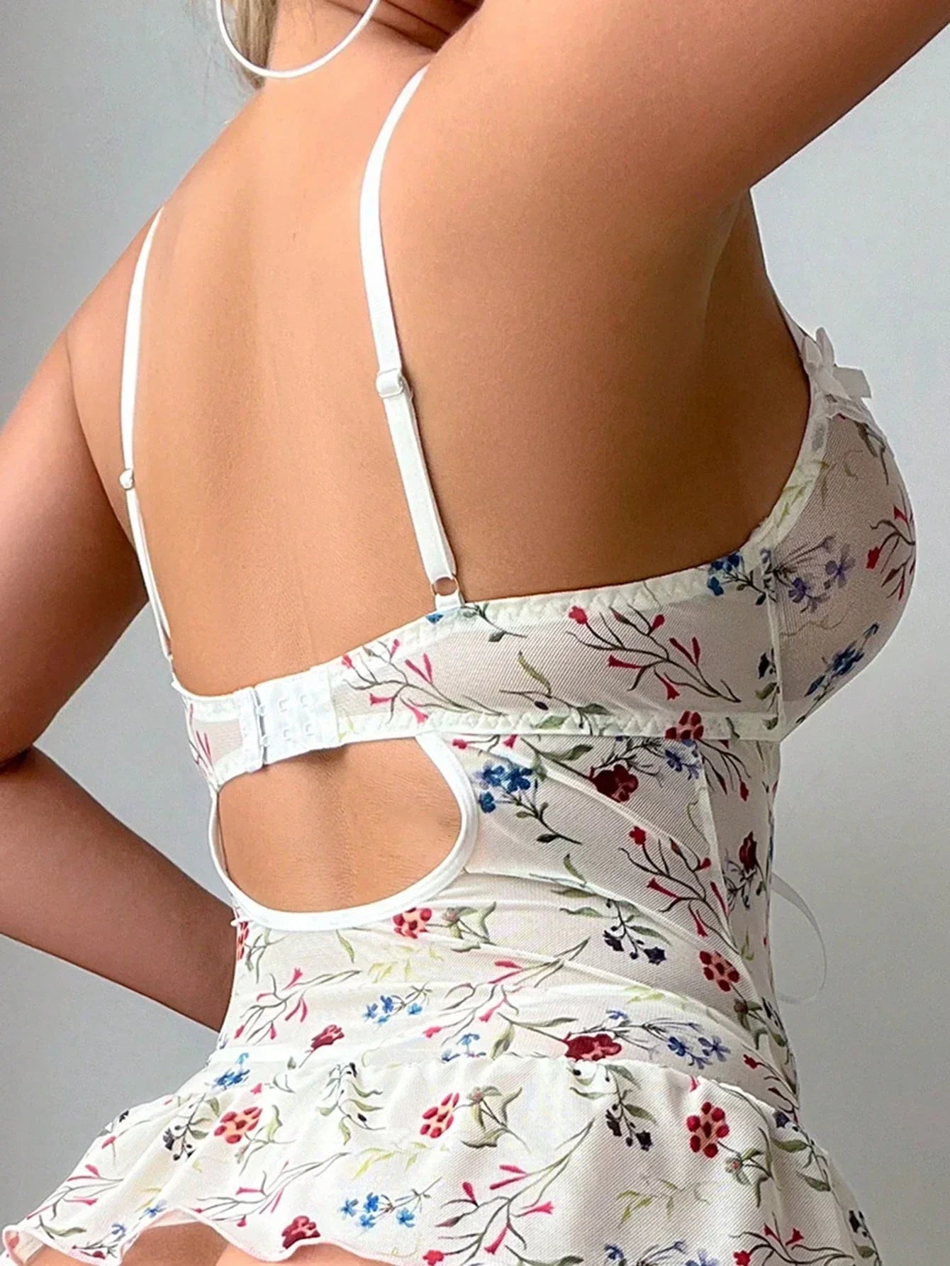Lace bodysuit with a floral pattern