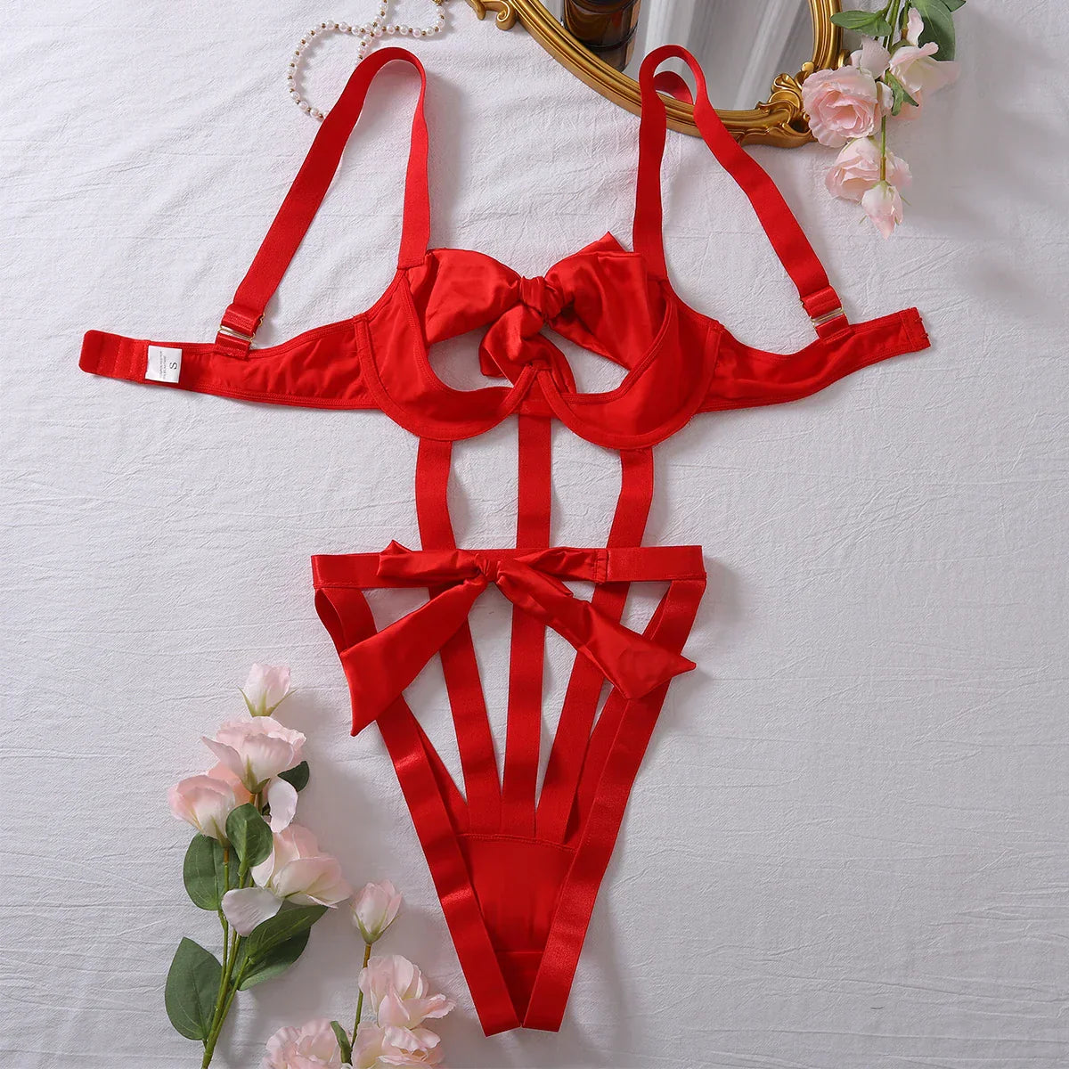 Body with a deep neckline and a bow on the bust.
