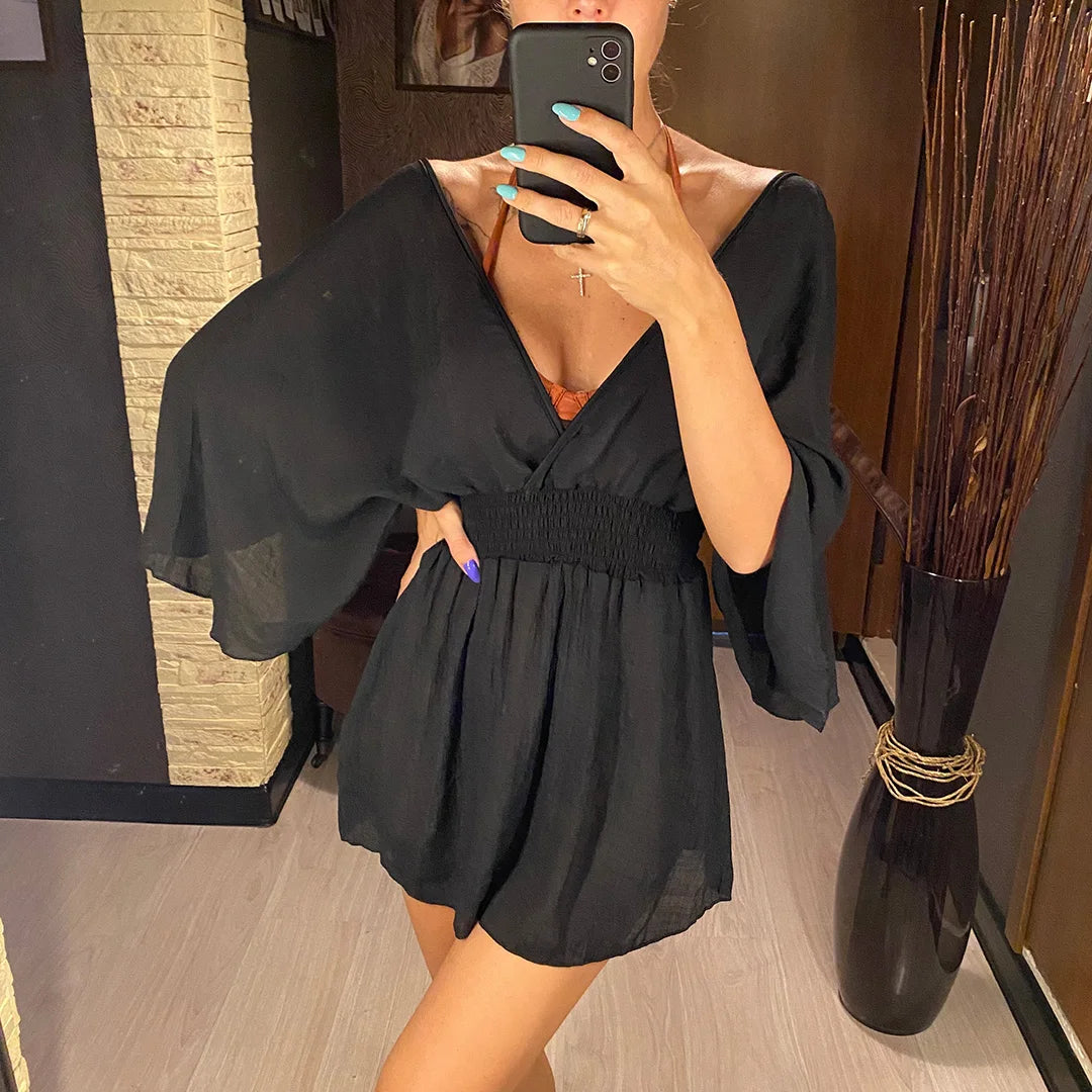 Breezy beach dress with a deep wrap neckline.