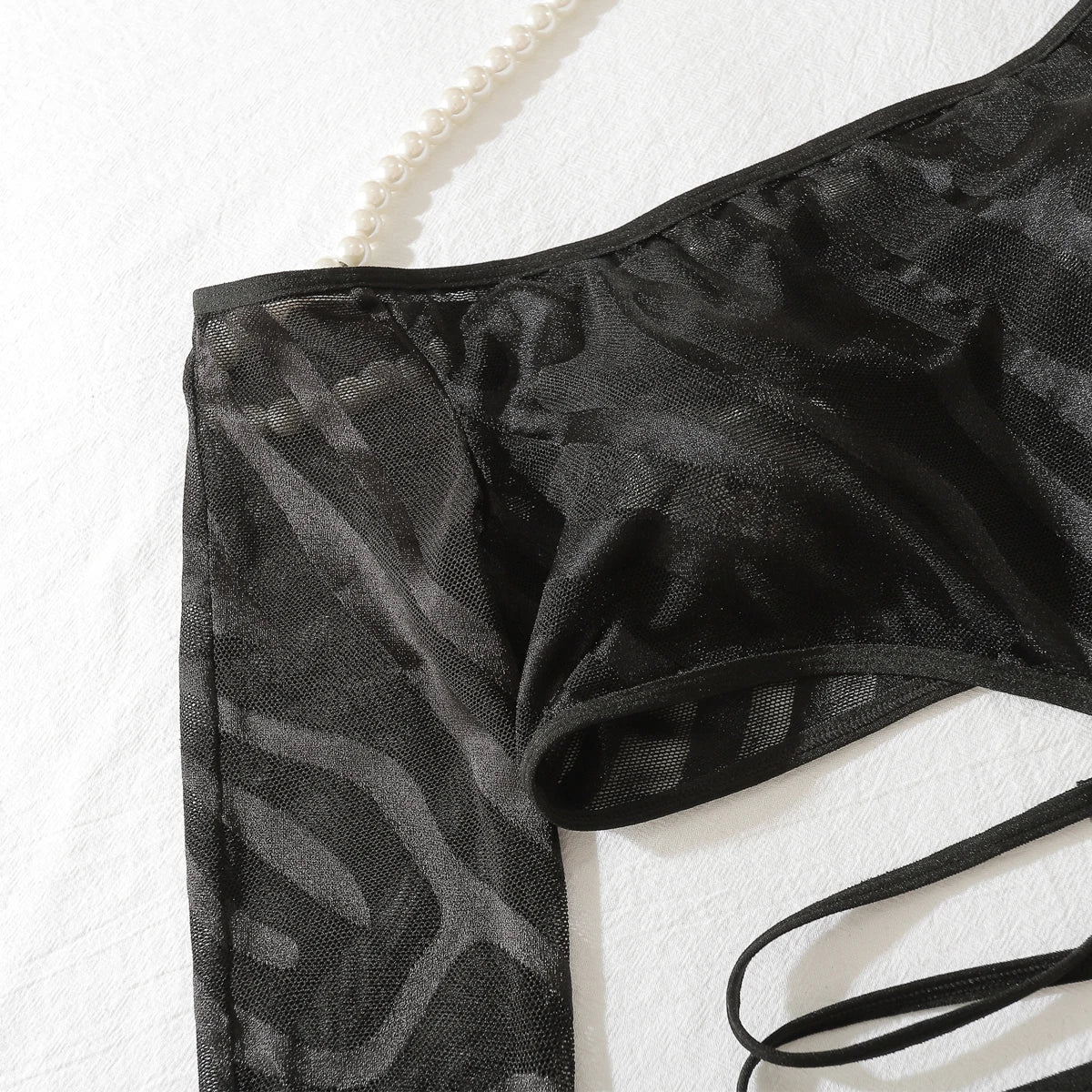 A complete bodystocking lingerie set made of sheer mesh material.