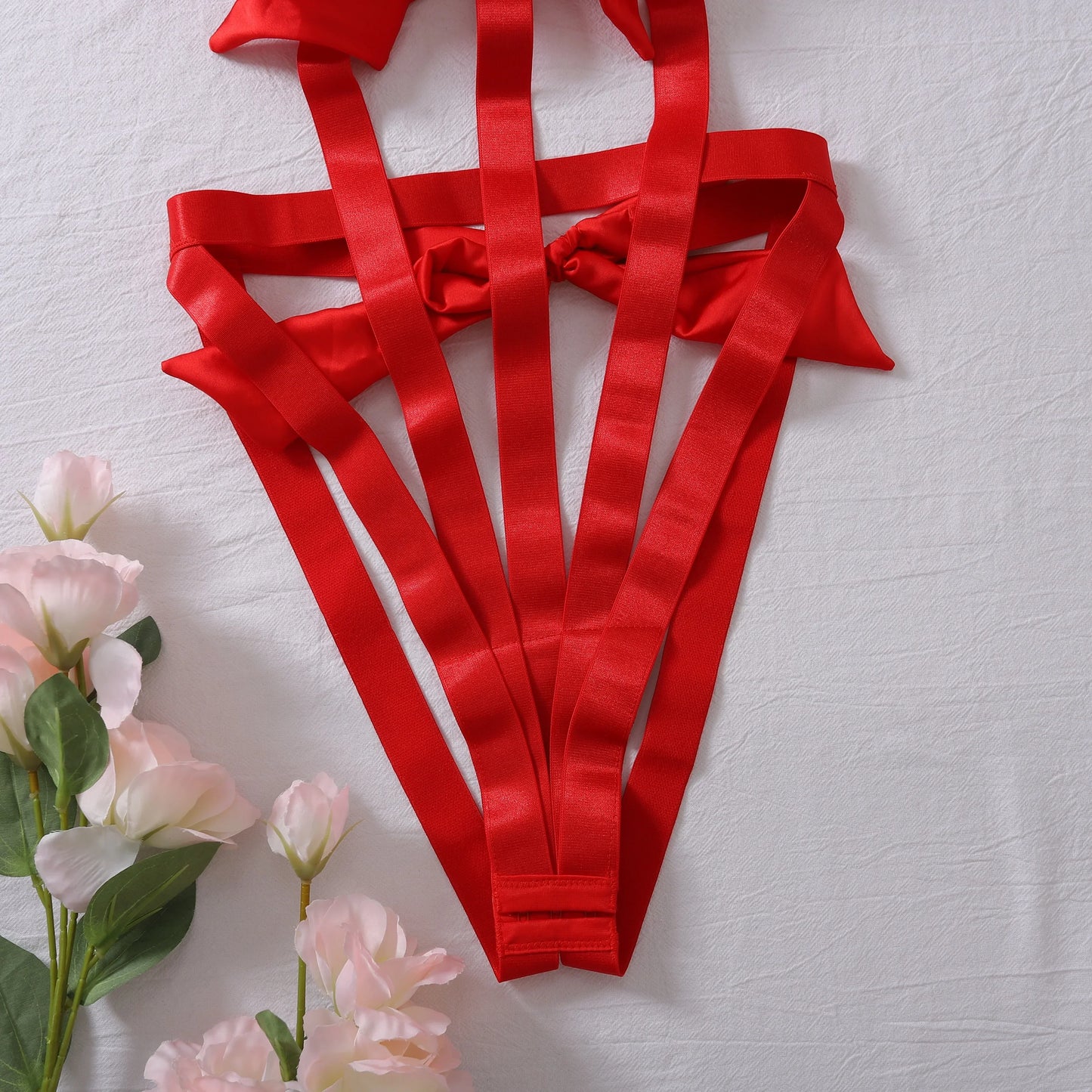 Body with a deep neckline and a bow on the bust.