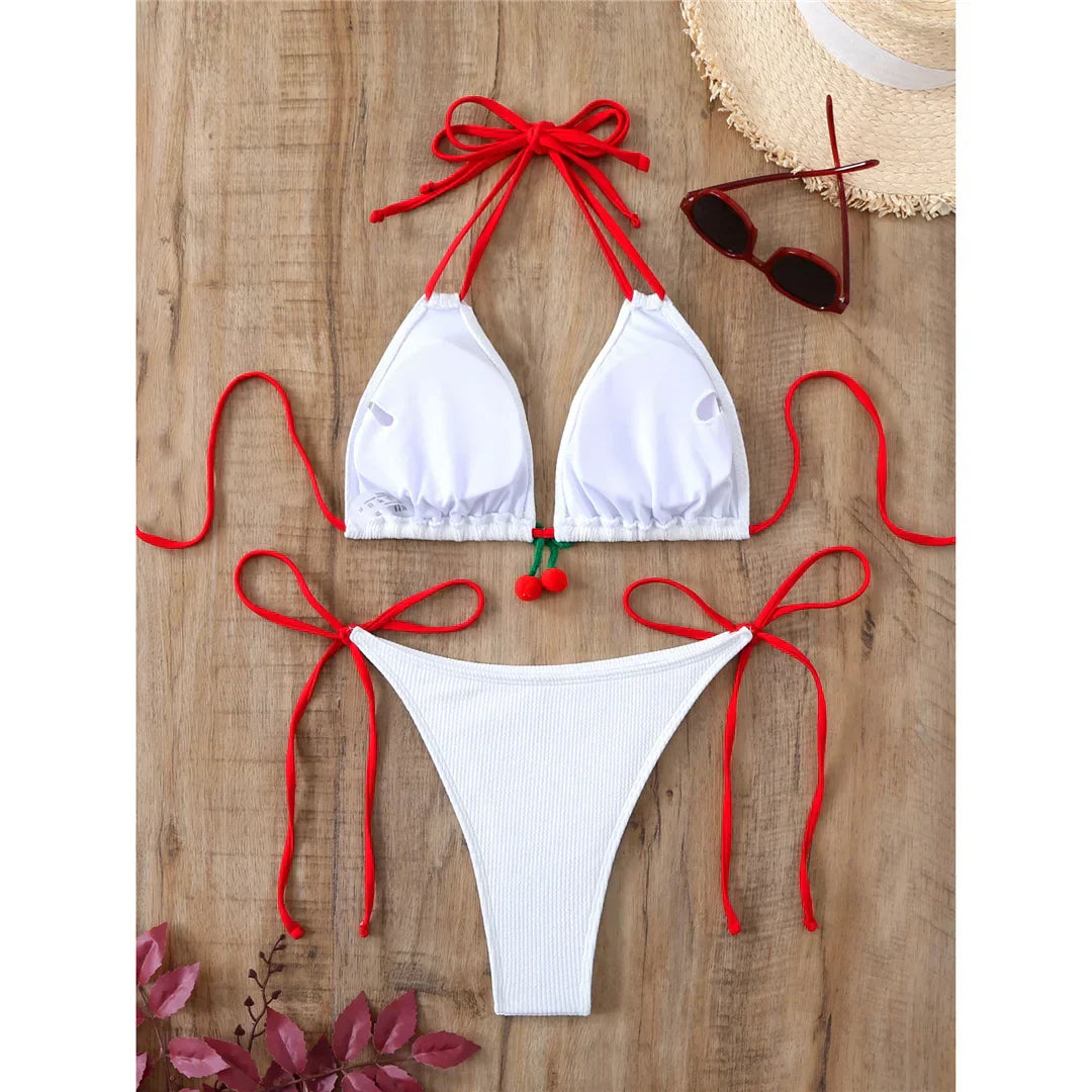 Two-piece swimsuit with ties at the hips and neck.