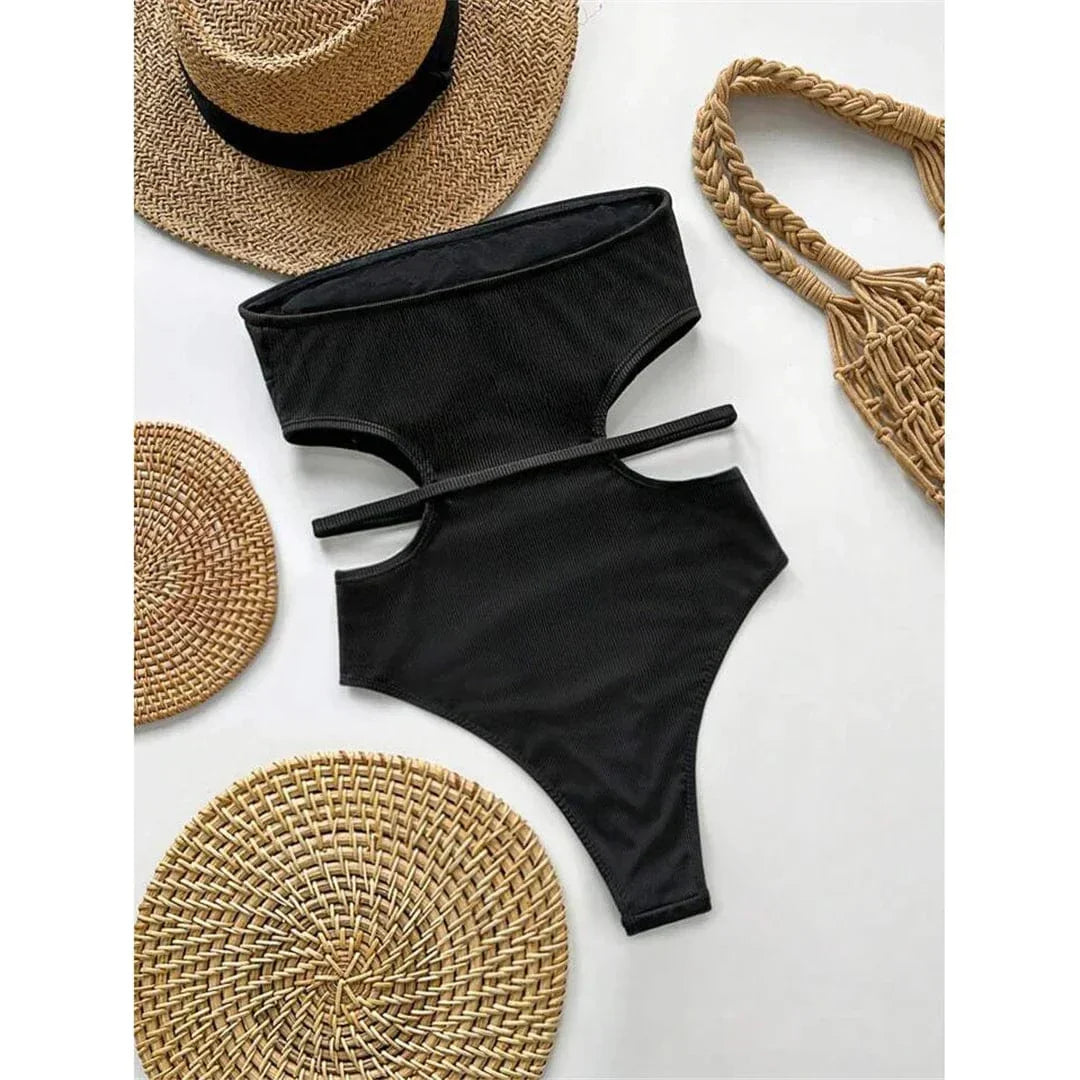 One-piece swimsuit with cut-outs at the waist.