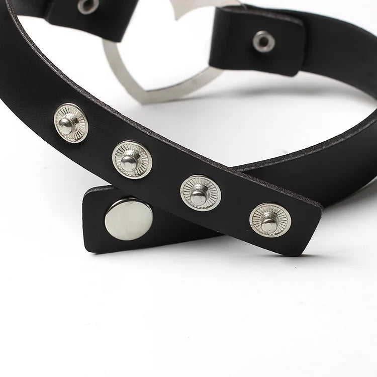Adjustable leather choker with a heart.