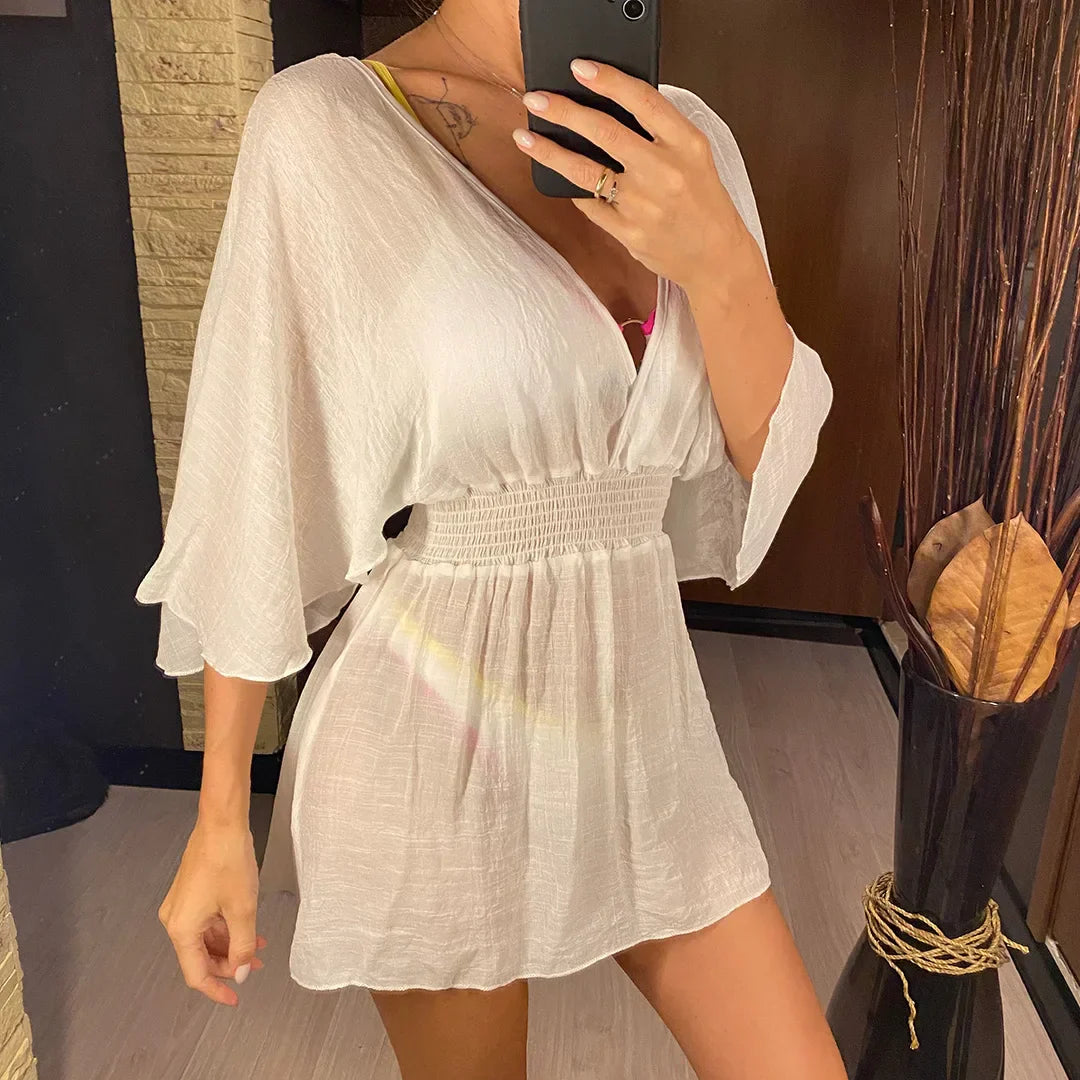 Breezy beach dress with a deep wrap neckline.