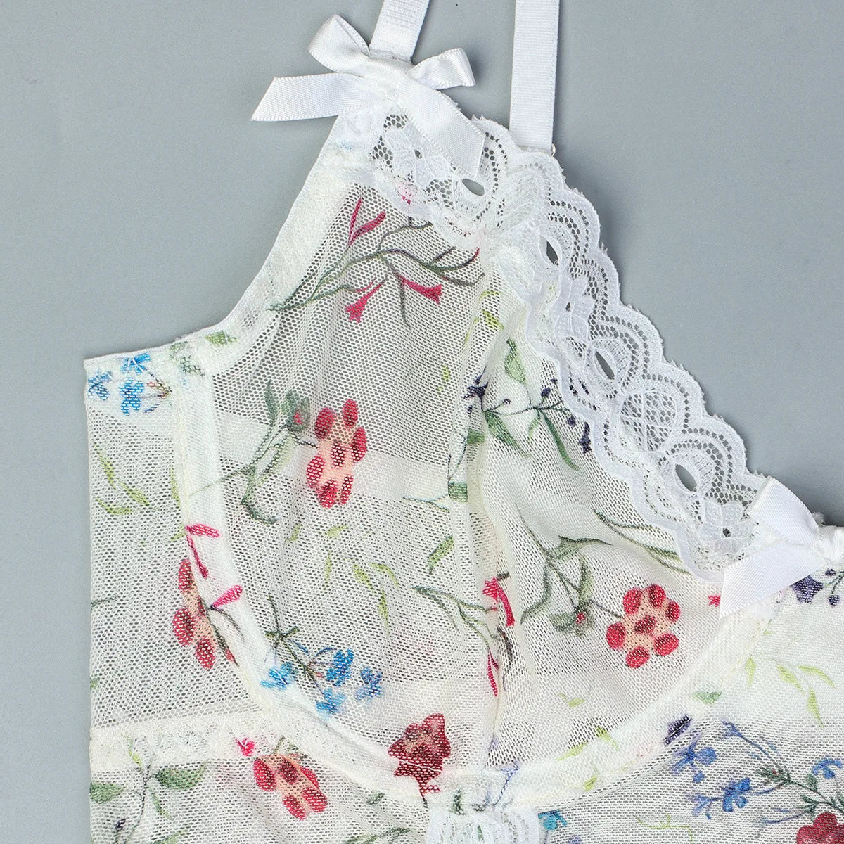 Lace bodysuit with a floral pattern