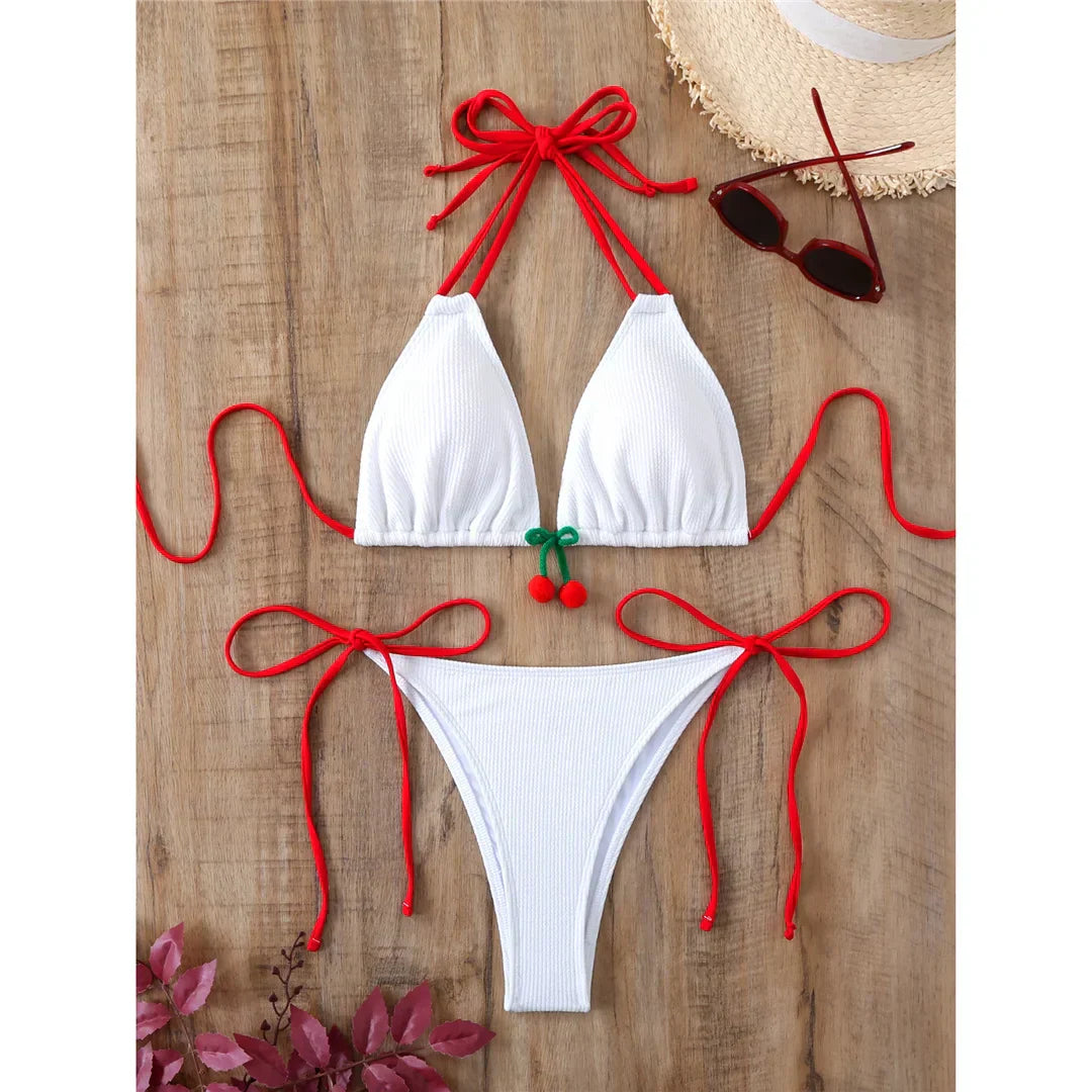 Two-piece swimsuit with ties at the hips and neck.