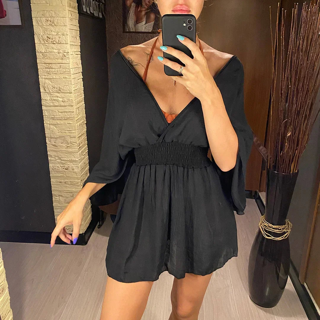 Breezy beach dress with a deep wrap neckline.