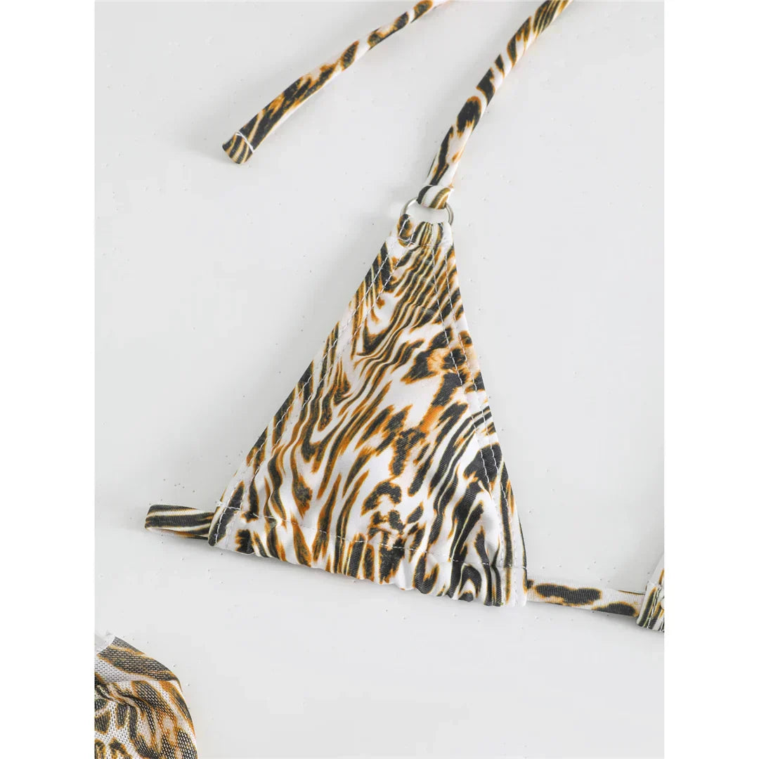 Two-piece leopard print swimsuit with a tie-up bikini top.