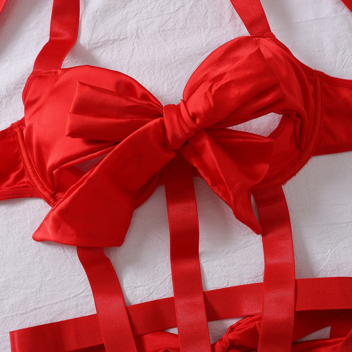 Body with a deep neckline and a bow on the bust.