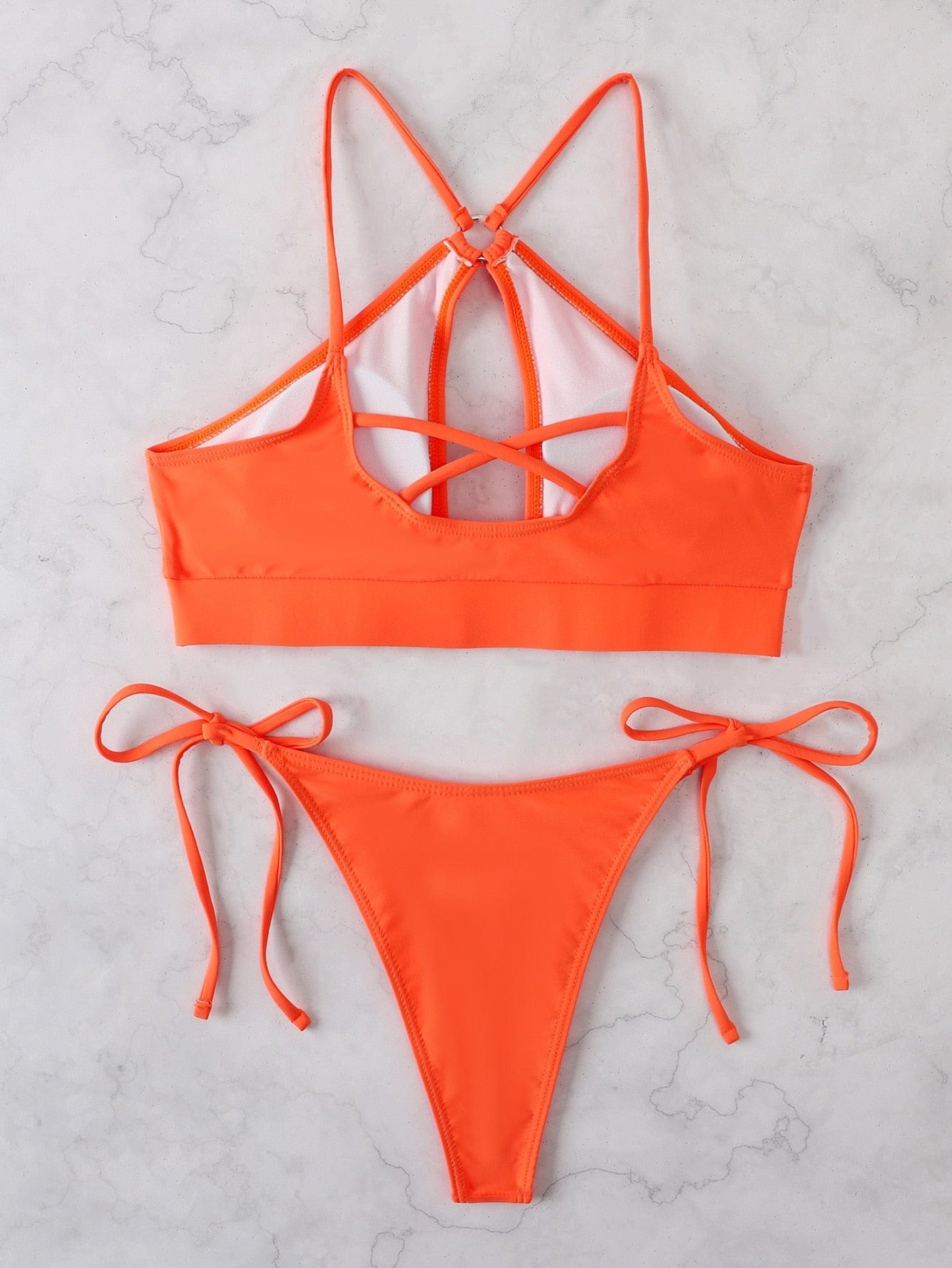 Two-piece swimsuit with a cut-out at the bust.