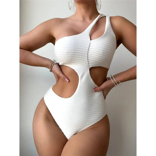 Asymmetrical one-piece swimsuit with cut-outs at the waist