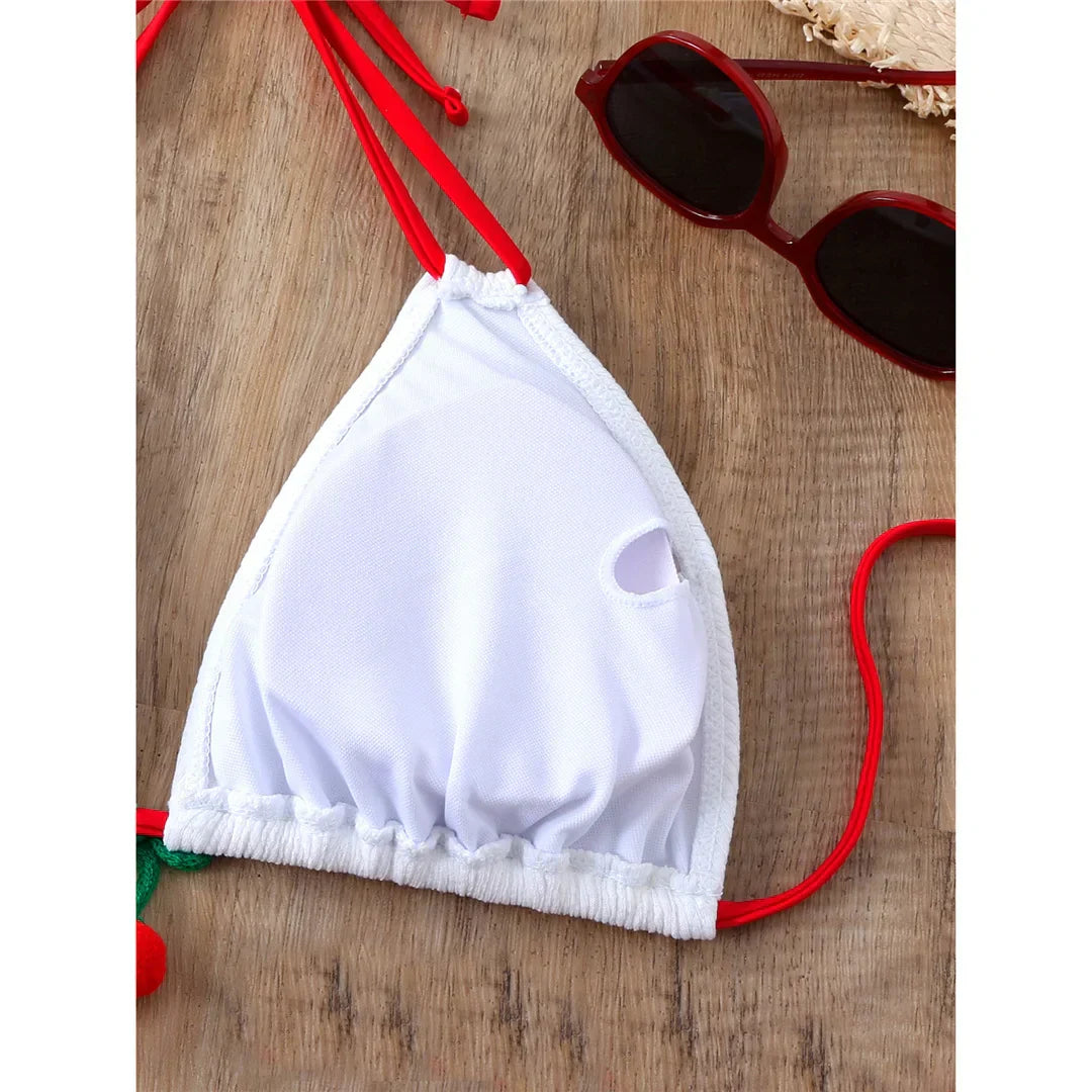 Two-piece swimsuit with ties at the hips and neck.