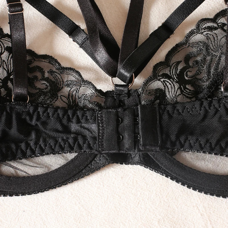 A lingerie set with a suspender belt adorned with feathers.