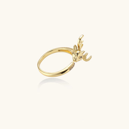 Gold-plated brass deer antler ring with cubic zirconia stones featuring detailed stag head design on white background.