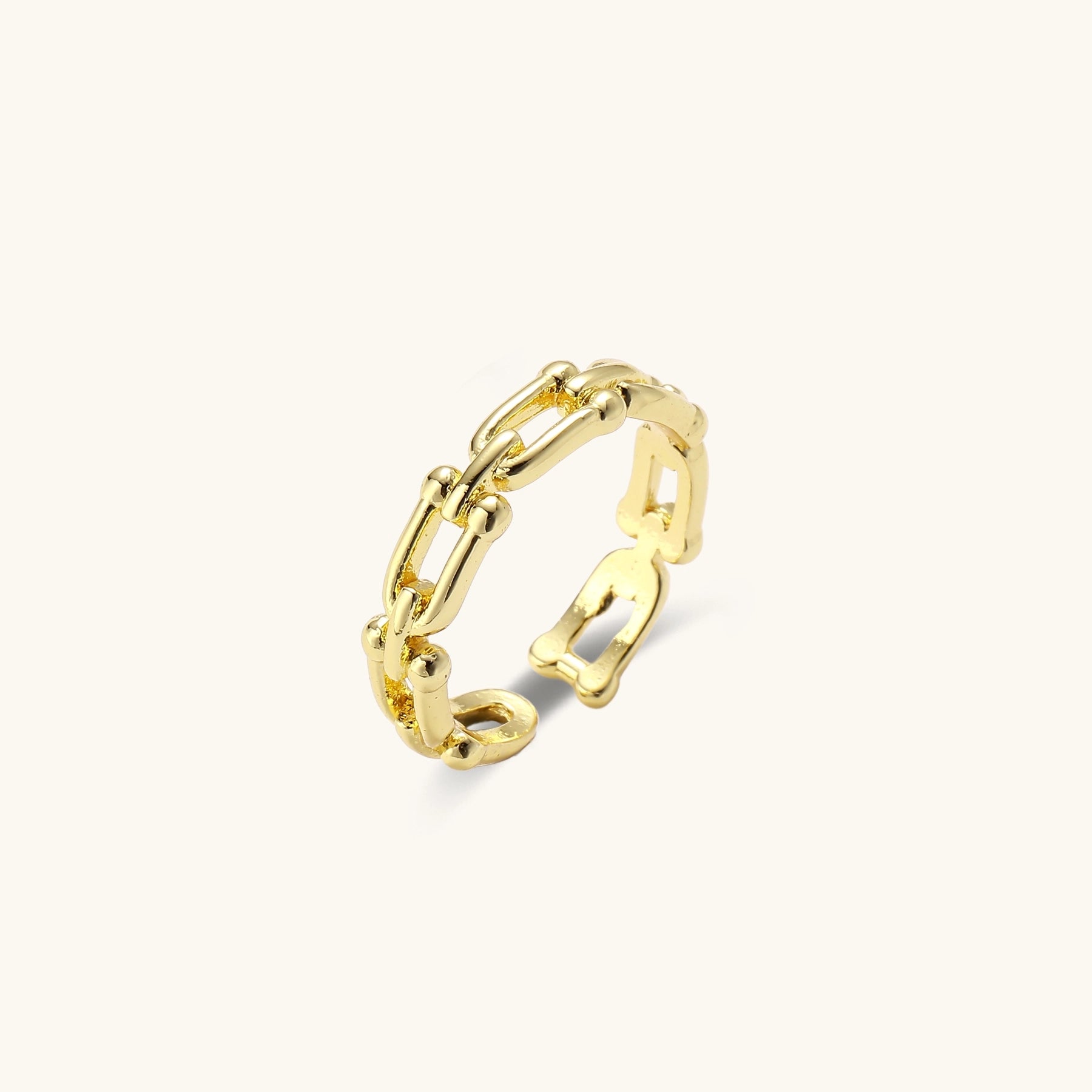 Two gold-plated rings with cubic zirconia halo design and chain-link band on white background, adjustable sizing.