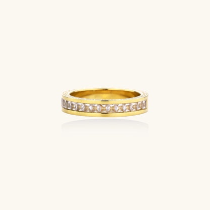 14K gold plated ring with channel-set zirconia stones and Greek key pattern engraved on sides on white background