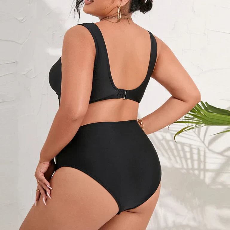 Plus size two-piece swimsuit with high-waisted bottoms.