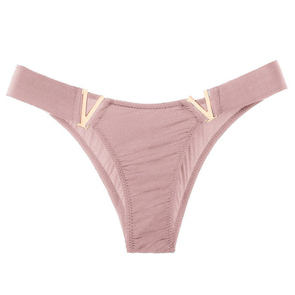 Fig leaves with metal elements in rose gold colour.