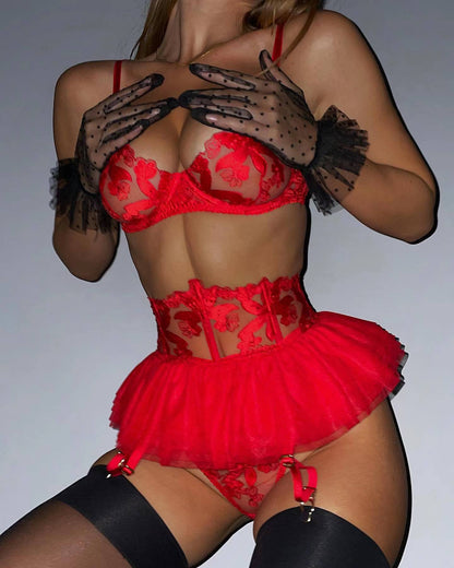 A set of lingerie made from sheer material with a floral pattern.