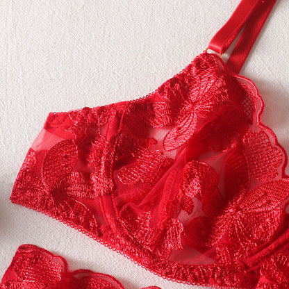 A set of lingerie made from sheer material with a floral pattern.