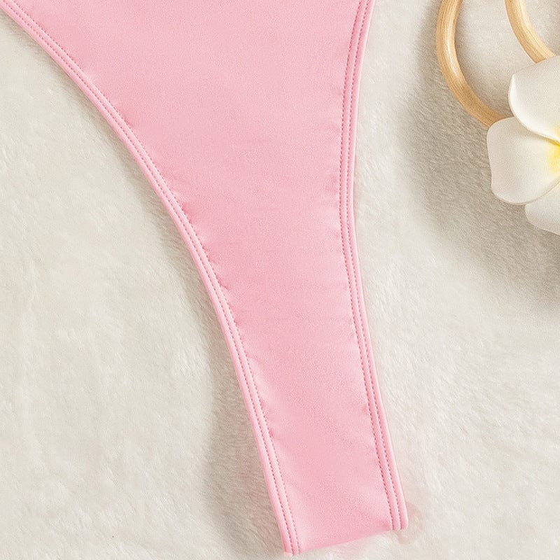 One-piece swimsuit with a cut-out at the back.