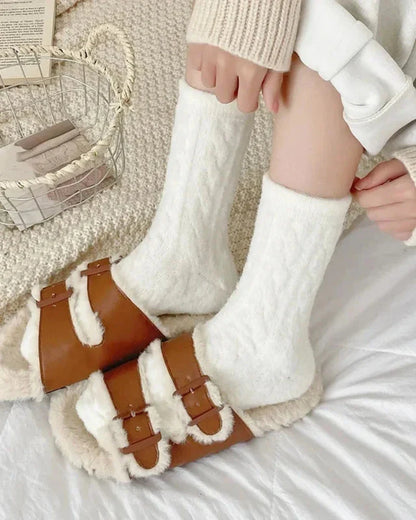 Long fluffy socks with a braided pattern