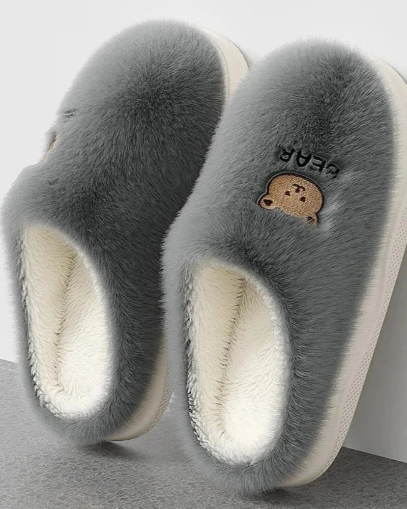 Warm fluffy slippers with a bear