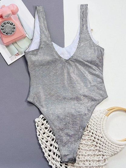 One-piece swimsuit with decorative chains