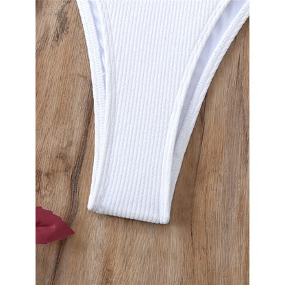 Two-piece swimsuit with ties at the hips and neck.