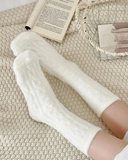 Long fluffy socks with a braided pattern