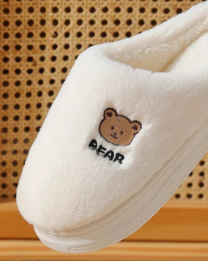 Warm fluffy slippers with a bear