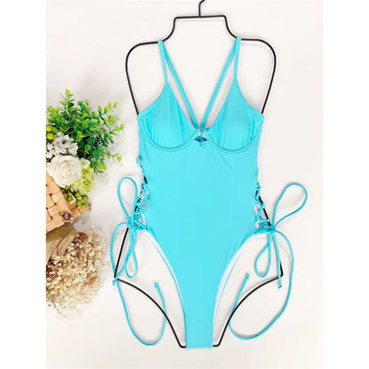 One-piece swimsuit with unique lacing at the hips.