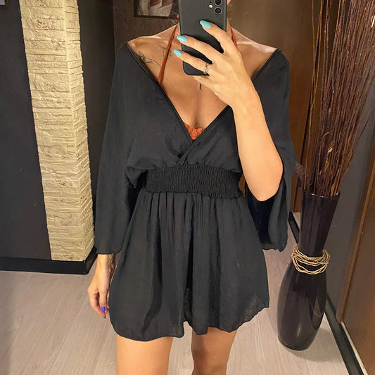 Breezy beach dress with a deep wrap neckline.