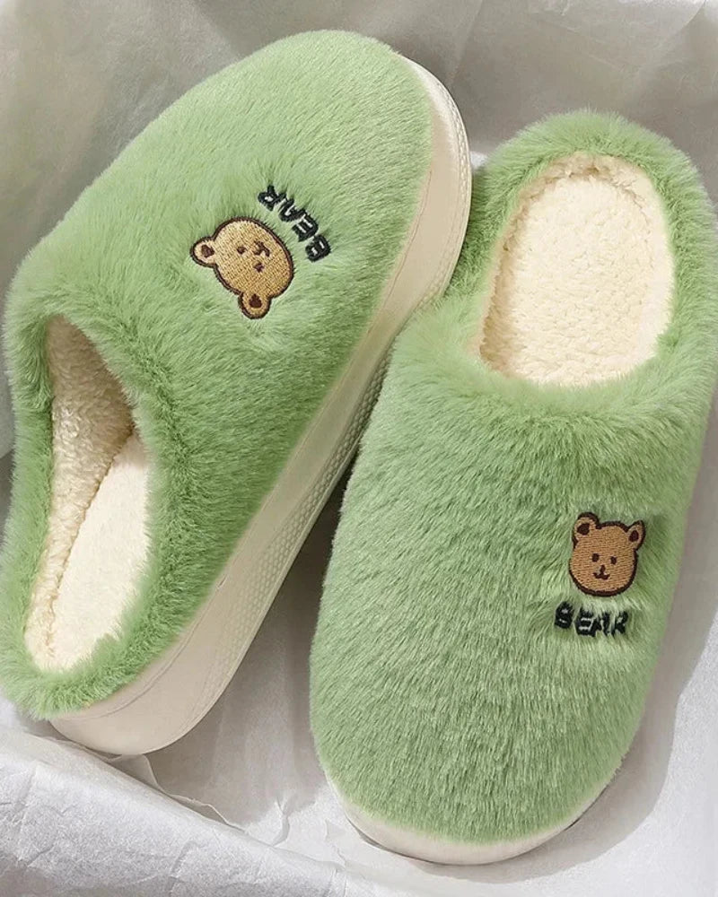 Warm fluffy slippers with a bear