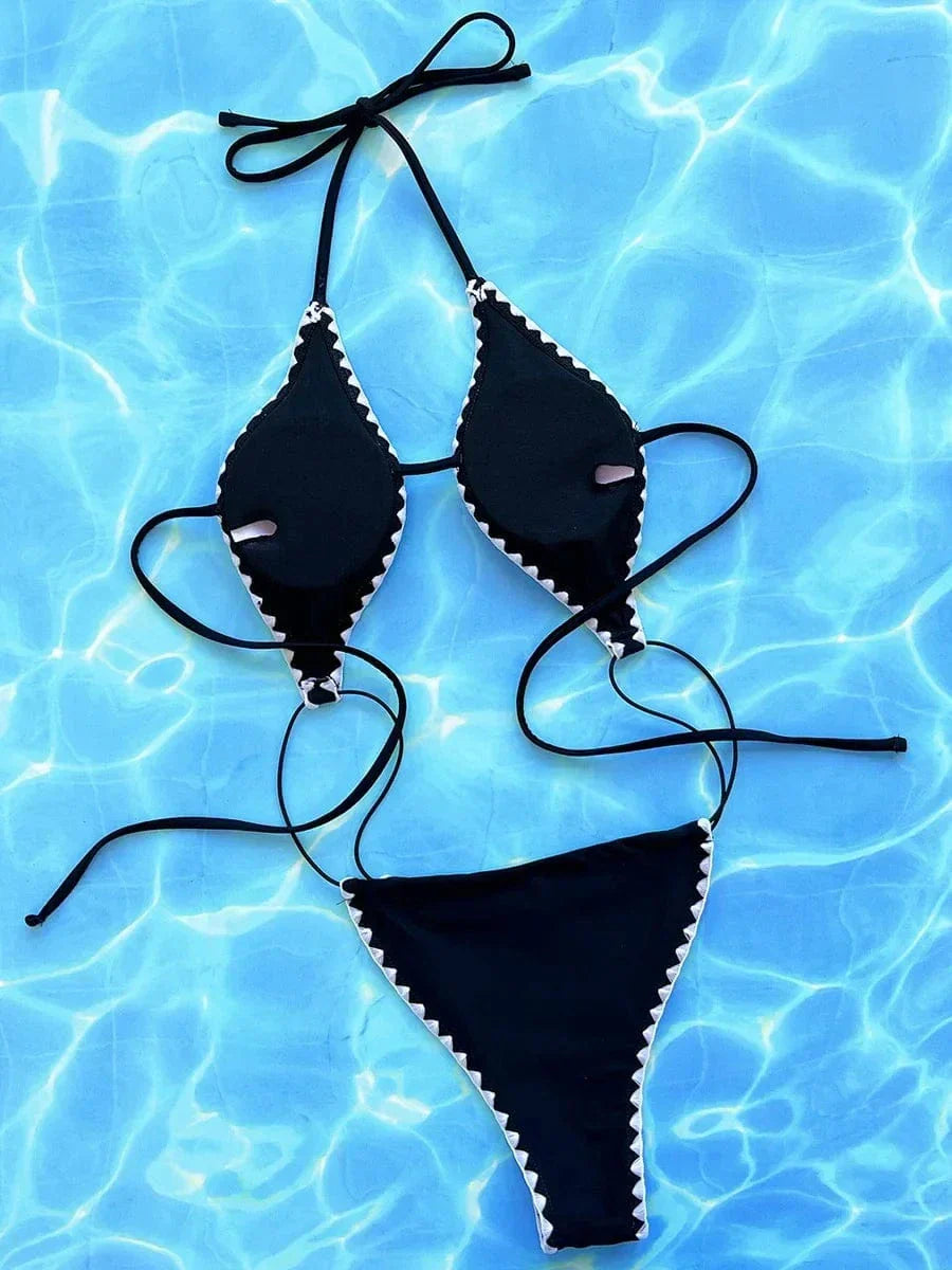 One-piece swimsuit with a deep cut.