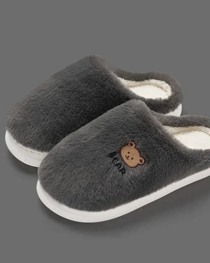 Warm fluffy slippers with a bear