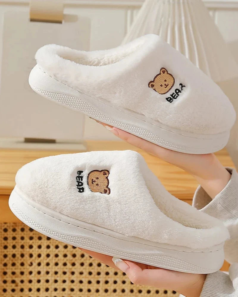 Warm fluffy slippers with a bear